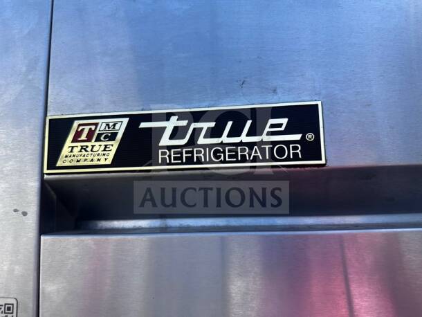 True TG2R-2S Spec Series Refrigerator label, indicating brand and model. Stainless steel finish in top-tier condition.