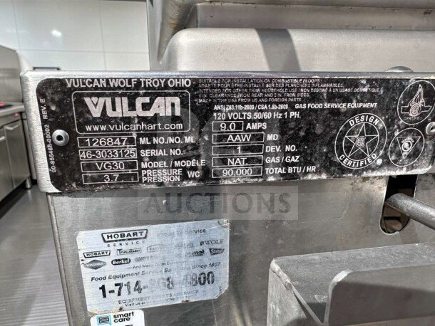Vulcan VG30-NAT 30-gallon commercial gas tilt skillet, 90,000 BTU, natural gas. Tags show serial number and specifications.