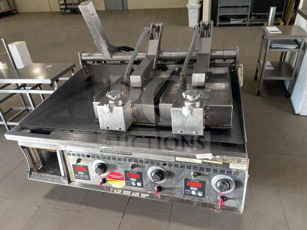 Keating Miraclean® 36" gas griddle in excellent condition, UL & NSF listed. Features operational controls and top-side cooker.