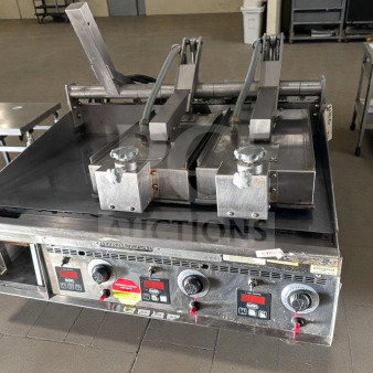 Keating Miraclean® 36" gas griddle in excellent condition, UL & NSF listed. Features operational controls and top-side cooker.