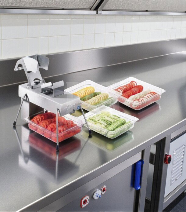 Edlund Series 350 commercial slicer, stainless steel and aluminum, 115V, NSF listed, fully operational, shown slicing produce.
