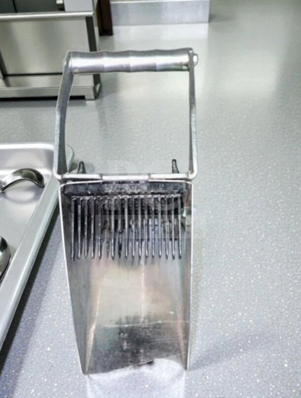 Edlund Series 350 electric tomato slicer, stainless steel and aluminum. NSF listed, fully tested, dependable condition.