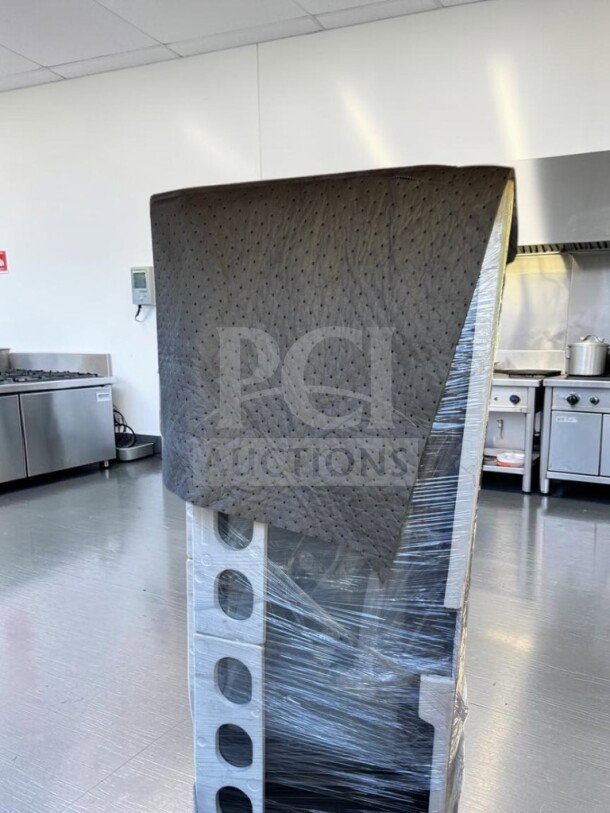 Brand new Marchia MVS500-B vertical refrigerated cake display case in black, wrapped and ready for use.