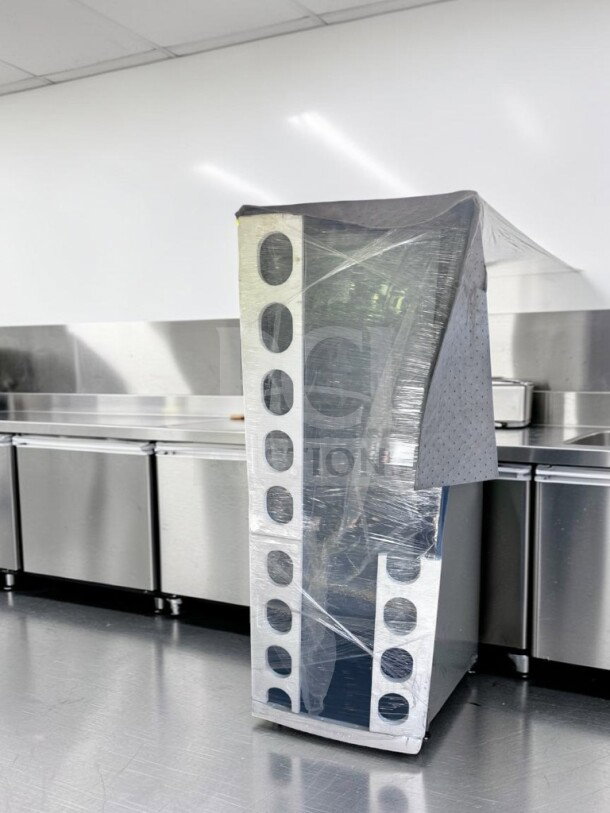 Brand new Marchia MVS500-B vertical refrigerated cake display case, black exterior, LED lighting, wrapped, ETL/NSF certified.