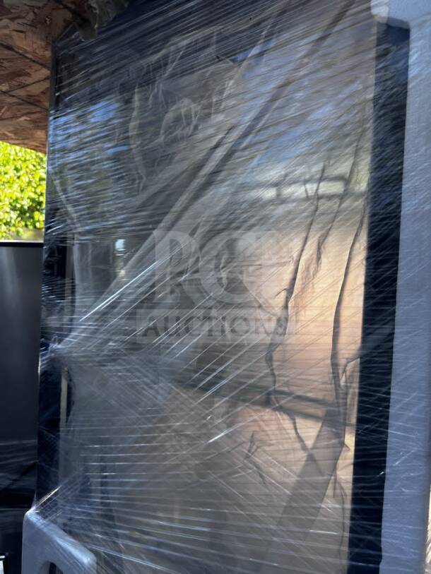 Brand new Marchia MVS500-B vertical refrigerated cake display, black exterior, LED lighting, wrapped, ETL/NSF certified.