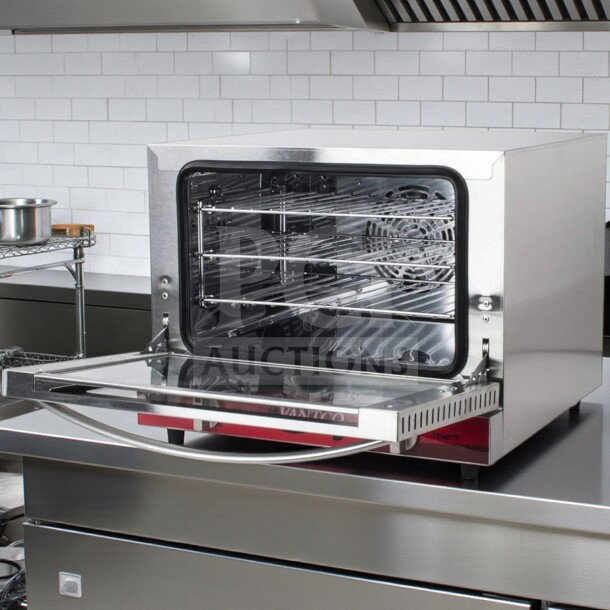 Flawless Avantco CO-14 countertop convection oven, 0.8 Cu. Ft., stainless steel, ETL listed, 120V, 1440W, open door.