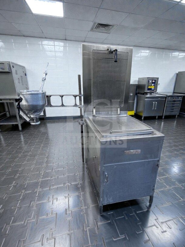 Excellent condition Lucks G1826 commercial natural gas donut fryer, stainless steel, 60,000 BTU, with donut screen and manual depositor.