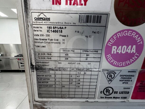Carpigiani 193 SP/USA P soft serve machine label, showing specs: 208–230V, 3 phase, R404A refrigerant, UL/NSF listed.