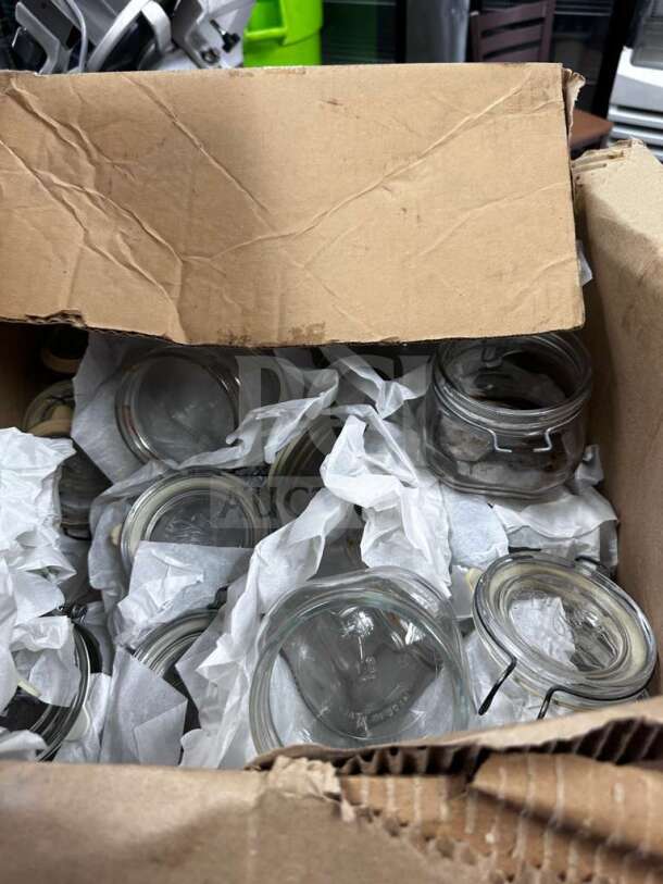 Box of Bormioli Rocco Fido 1/2L glass jars, pristine condition, airtight clamp lids, wrapped in paper, Made in Italy.