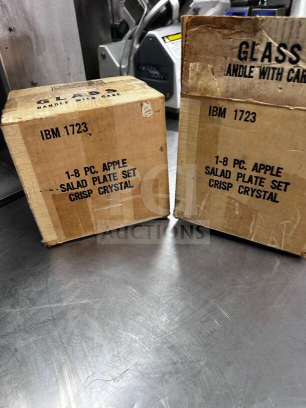Boxes labeled "1-8 PC. Apple Salad Plate Set Crisp Crystal" with "IBM 1723" and "Glass Handle with Care" warnings.