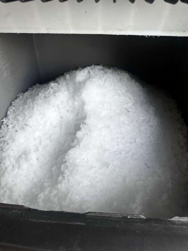 Scotsman NME1254AS-32B ice machine interior with fresh nugget ice. Outstanding condition, air-cooled, 1,220 lb/24 hr output.
