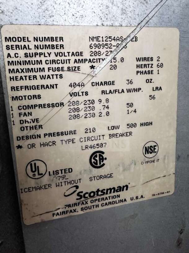 Label on Scotsman NME1254AS-32B ice machine showing model, serial number, voltage, and specifications.