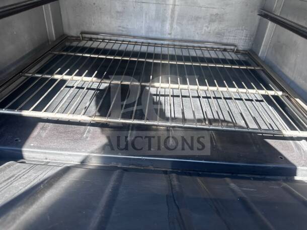 Interior view of Wolf C48S-2B36G gas range, showing oven rack and clean, spacious cooking area.