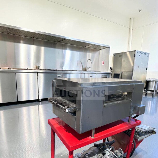 Star Holman QT14 commercial conveyor toaster oven in exceptional condition on red stand, 208/240V, fully tested.