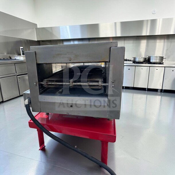 Star Holman QT14 commercial conveyor sandwich toaster oven in excellent condition on a red stand, fully operational, 208/240V.