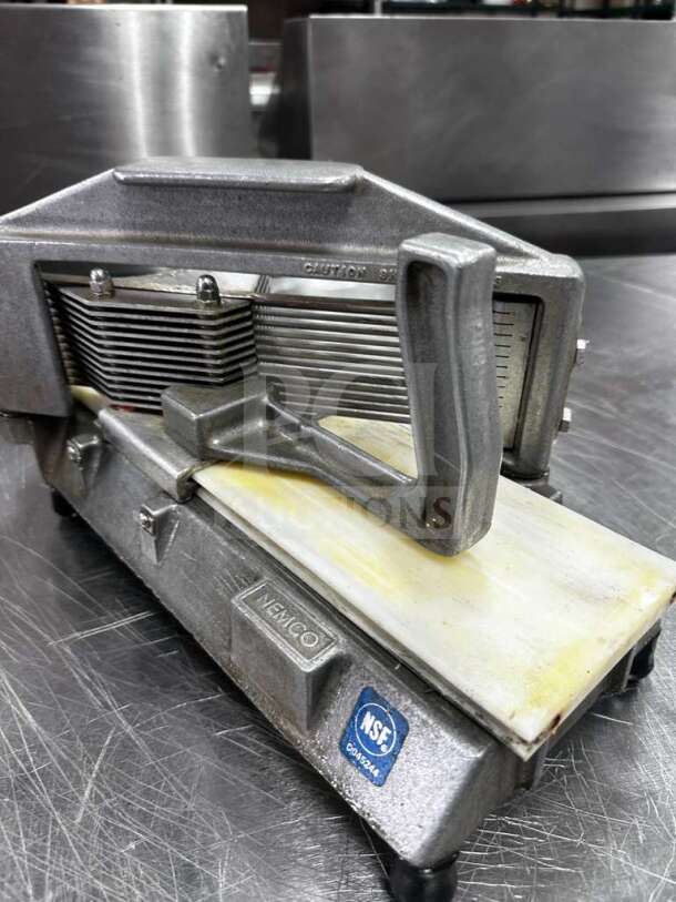 Nemco 55600-2 commercial tomato slicer, high-grade condition, 1/4" cut, NSF listed, fully tested, stainless steel build.