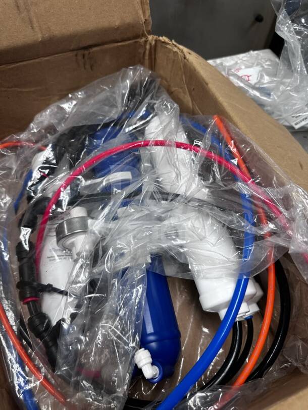 New Home Master Reverse Osmosis System in packaging, includes installation manual, by Perfect Water Technologies, model HOM-S-RO-1147.