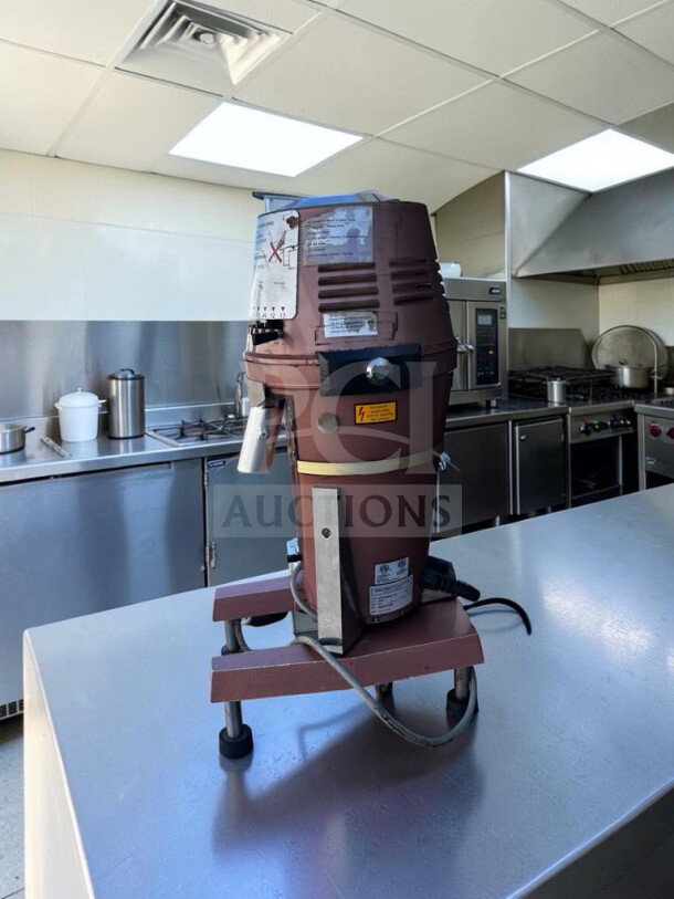 High-grade Mahlkönig VTA 6S commercial coffee grinder in excellent condition, fully operational, showing labels and power settings.