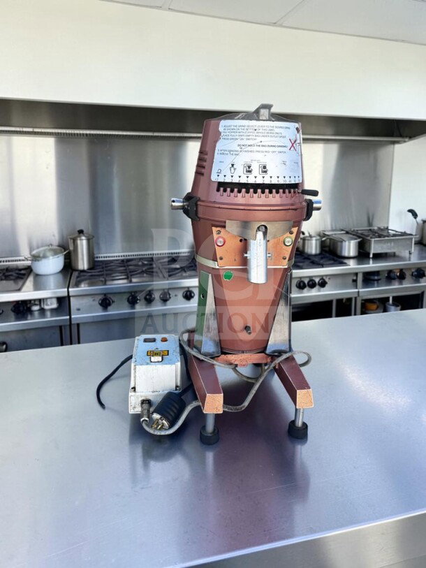 Alt Text: High-grade Mahlkönig VTA 6S commercial coffee grinder, model VTA6S10, three-phase, made in Germany, fully operational.
