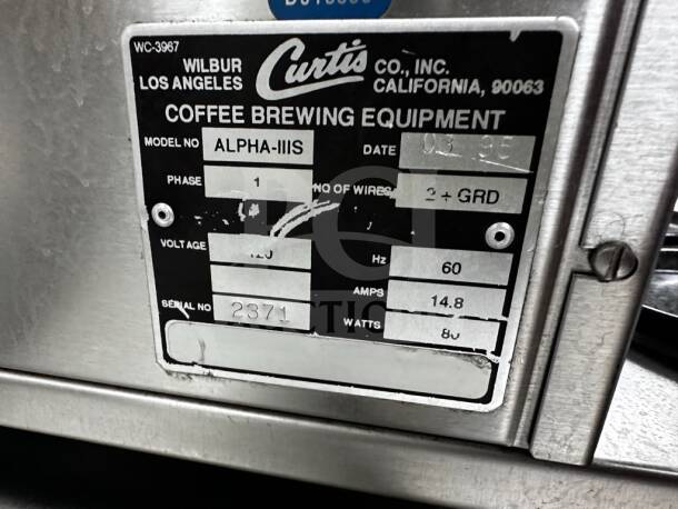 Wilbur Curtis ALPHA-IIIS Coffee Brewer label showing model, serial number 2371, voltage, and specifications.