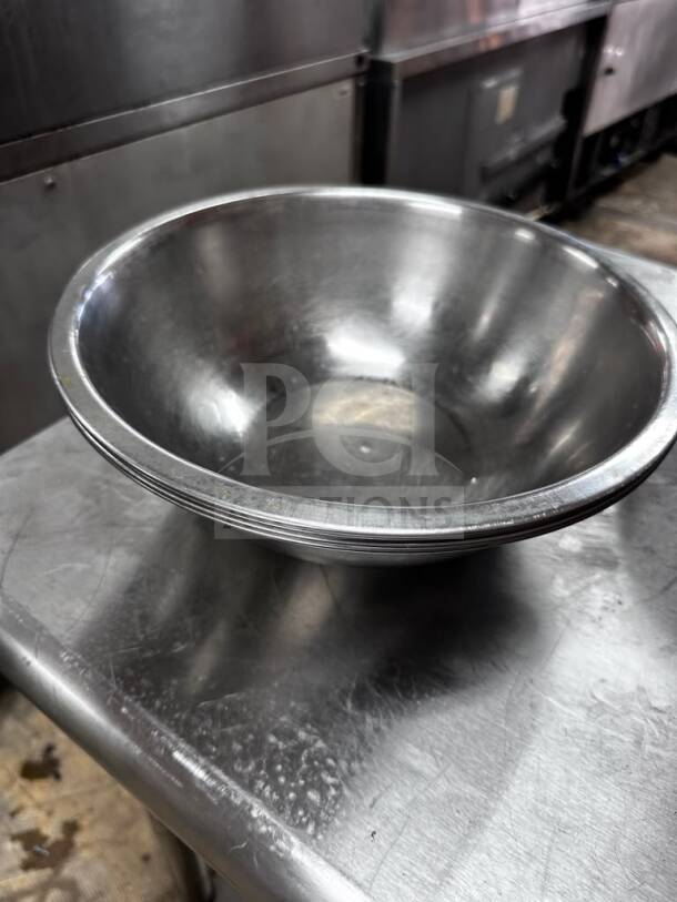 Stainless steel commercial salad/mixing bowl, 13" diameter, well-maintained, by Commercial Kitchen Smallwares.