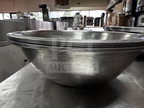 Set of 6 stainless steel commercial salad bowls, 13" diameter, well-maintained, by Commercial Kitchen Smallwares.