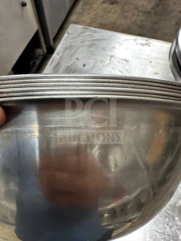 Stainless steel commercial mixing bowl, 13” diameter, well-maintained condition, suitable for commercial use.
