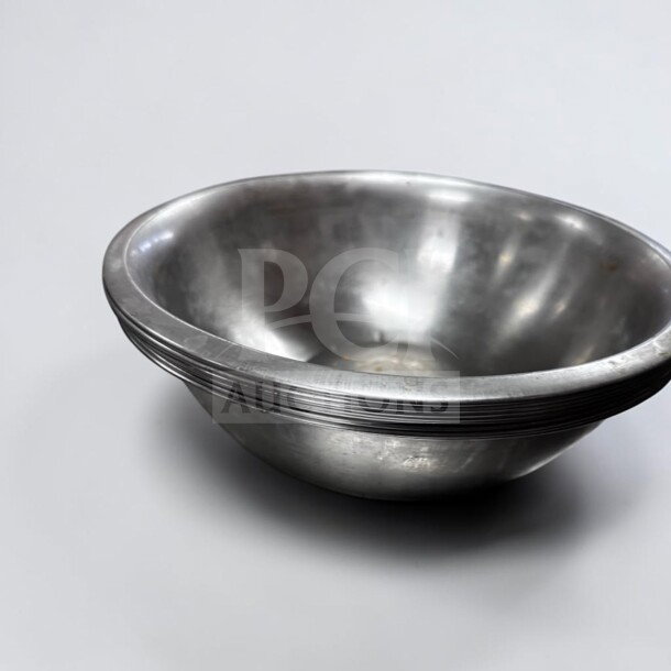 10" stainless steel commercial mixing bowl by Commercial Kitchen Smallwares. Well-maintained, stackable, set of 7.