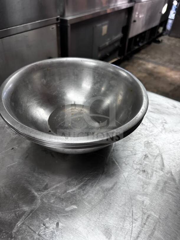 10” stainless steel commercial salad/mixing bowl, well-maintained, stackable, for commercial use, by Commercial Kitchen Smallwares.