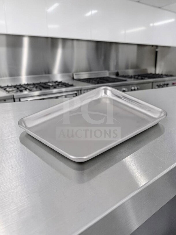 1/4 Size 18-gauge aluminum sheet pan, model ALU-S-PAN-1166, by Commercial Kitchen Smallwares, shown in commercial kitchen.
