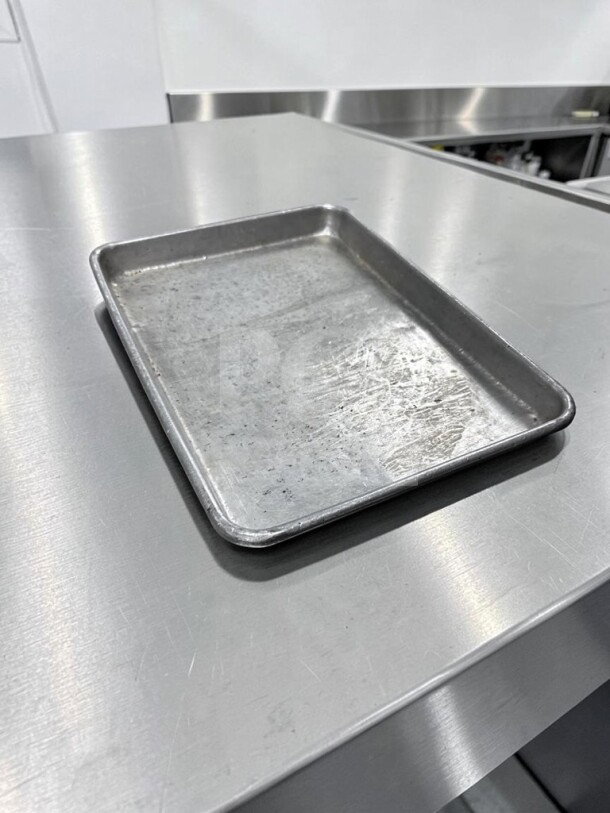 1/4 Size Aluminum Sheet Pan, 18 Gauge, Commercial Grade, by Commercial Kitchen Smallwares, in good condition, model ALU-S-PAN-1166.
