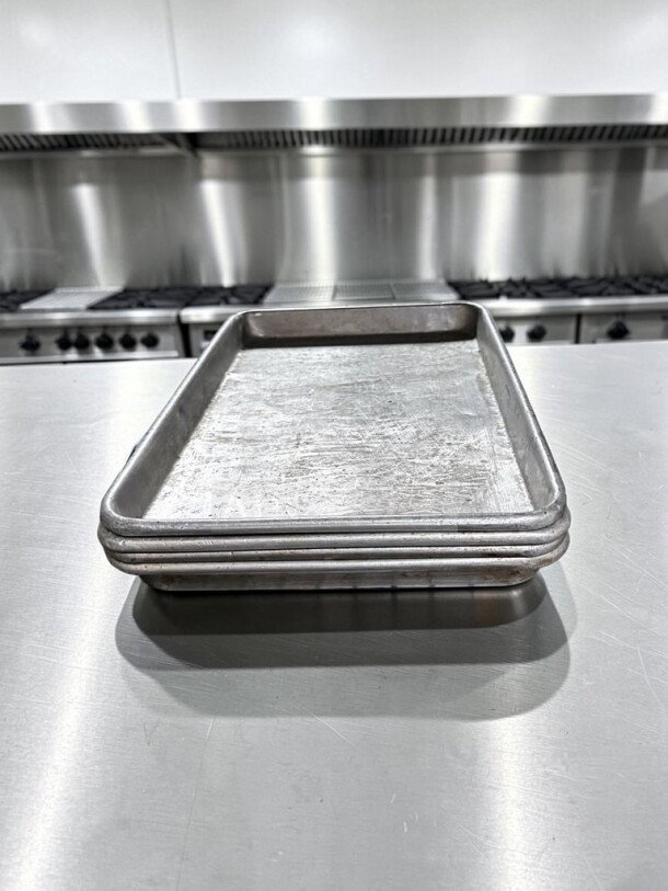 1/4 Size Aluminum Sheet Pans, 18 Gauge, by Commercial Kitchen Smallwares. Set of 40, used condition, commercial-ready.