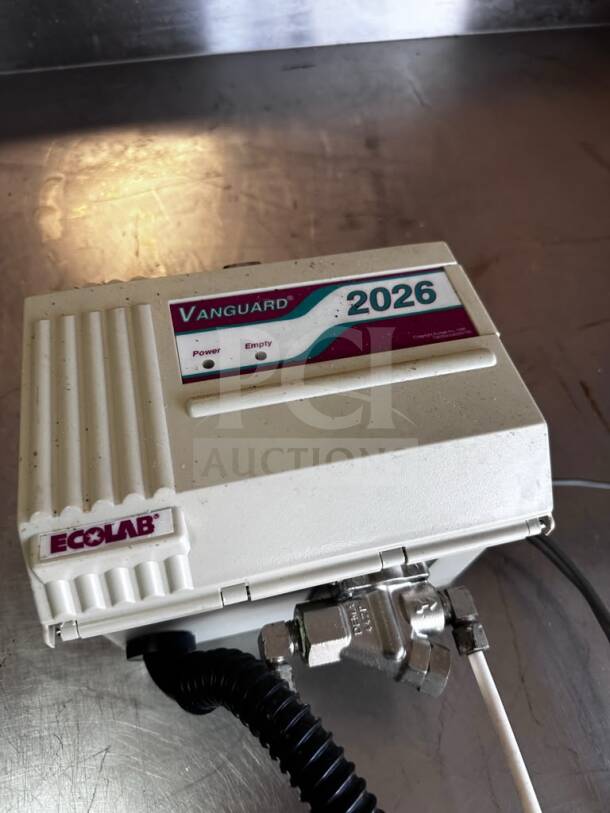 Ecolab Vanguard 2026 detergent dispenser, UL listed, commercial use, clean condition, visible logo and model label, tested operational.