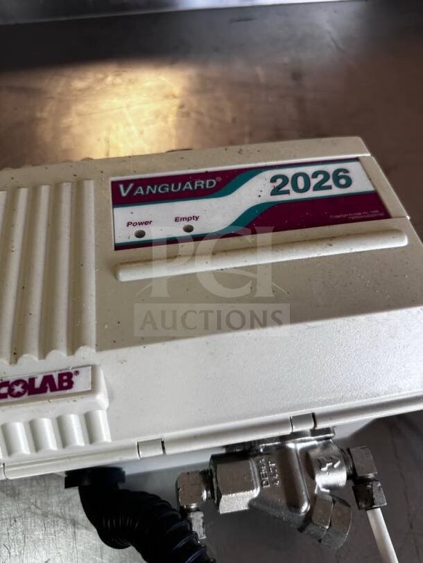 Ecolab Vanguard 2026 detergent dispenser, warewashing control, UL listed, tested, operational, with power and empty indicators.