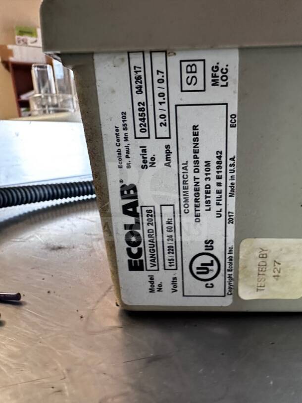 Ecolab Vanguard 2026 Commercial Detergent Dispenser, UL Listed, operational. Model info and serial number visible.