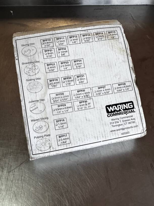 Waring Commercial BFP13 slicing plate box, pristine, 4mm disc for food processor, model details and company's address visible.
