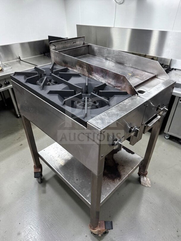 Commercial 24" propane cooktop with two 12" burners, 12" iron griddle, stainless steel stand, excellent condition.