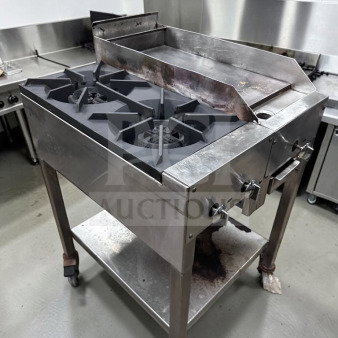 Commercial 24" propane cooktop with two 12" burners, 12" iron griddle, stainless steel stand, excellent condition.