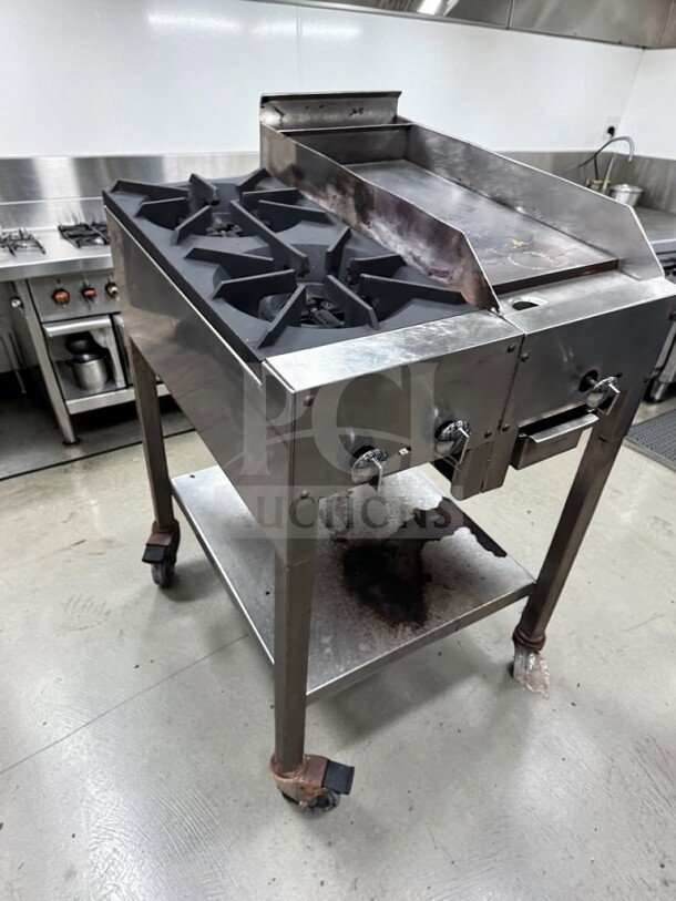 Commercial 24" propane cooktop with two 12" burners and 12" iron griddle on stainless steel stand, fully operational.