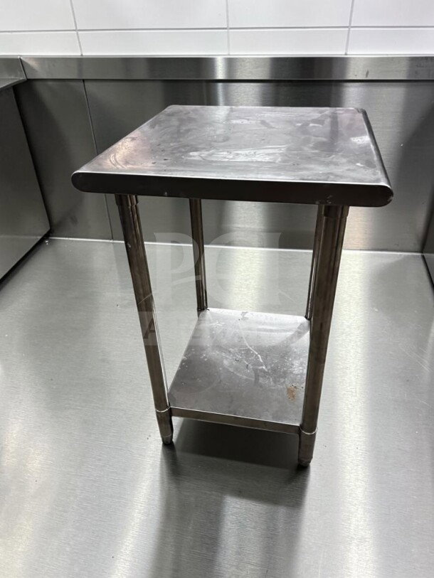 Stainless steel 24x24" commercial work table in immaculate condition, ideal for prep, by Commercial Kitchen Equipment.