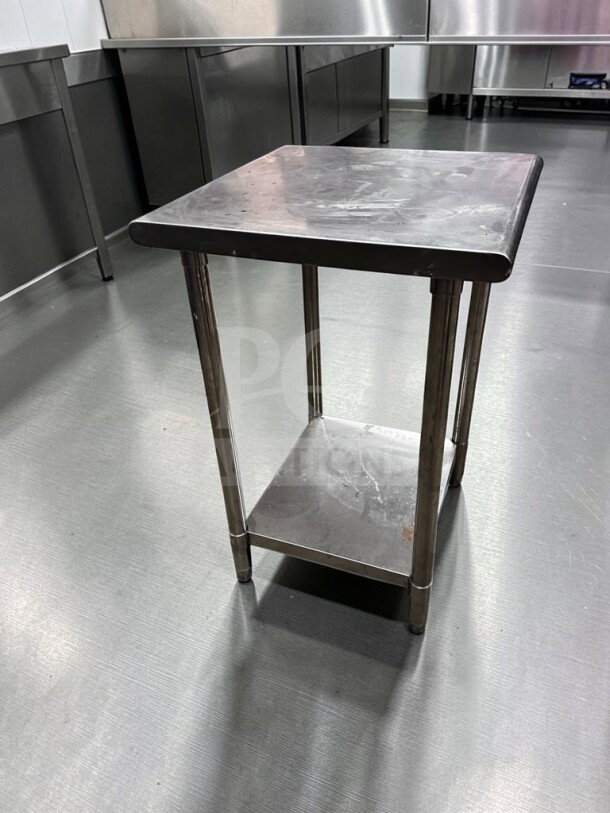 Stainless steel 24" x 24" commercial work table, immaculate condition, ideal for prep, by Commercial Kitchen Equipment.