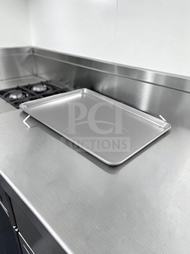 Full-size aluminum sheet pan, commercial grade, well-maintained condition, by Commercial Kitchen Smallwares, model ALU-S-PAN-1178.