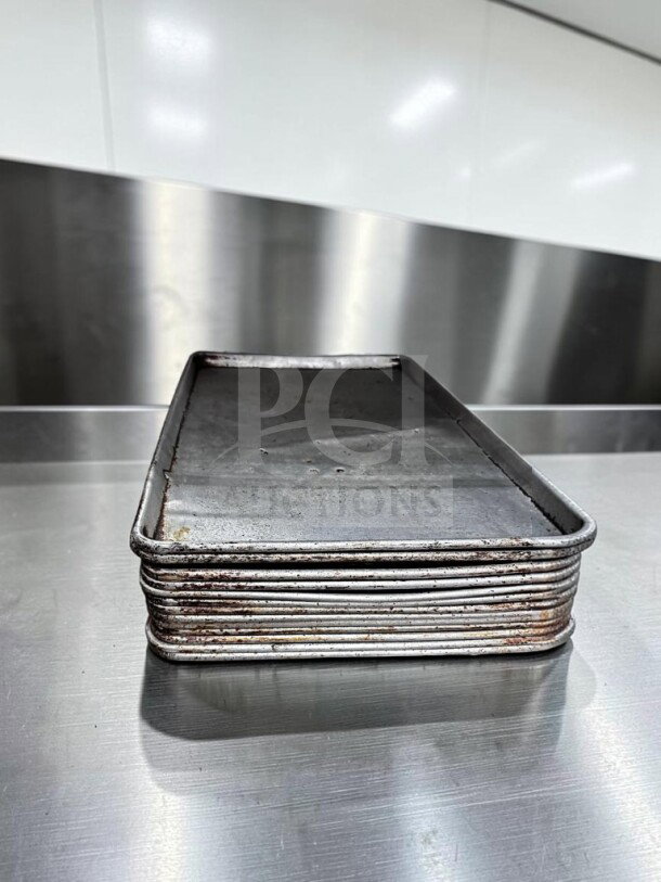 Full-size aluminum sheet pans by Commercial Kitchen Smallwares, model ALU-S-PAN-1178, well-maintained, set of 13, for commercial use.