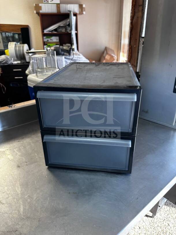 The Container Store storage container, excellent condition, two black bins with transparent drawers, ready for commercial or home use.