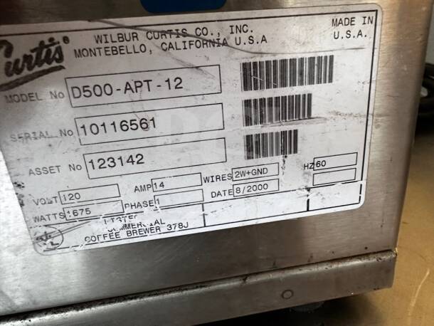 Wilbur Curtis D500-APT-12 airpot coffee brewer label, model, serial, and asset numbers, 120V, 60Hz, made in USA.