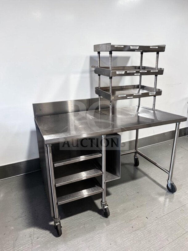 Pristine condition 60" x 34" custom stainless steel work table with over shelf, under table racks, and casters. Model GEN-S-TBL-1189.