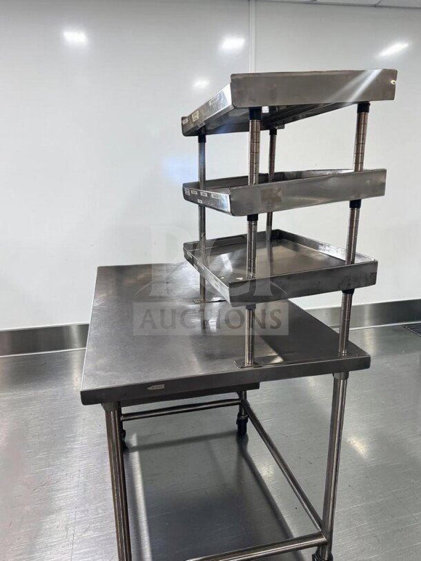 Commercial stainless steel work table, 60"x34", pristine, with over shelf, under table racks, casters; model GEN-S-TBL-1189.