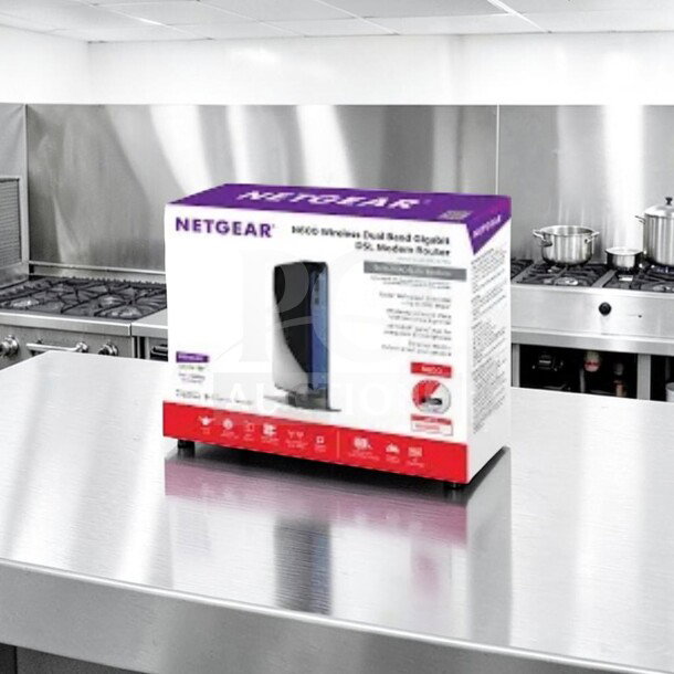 Brand new Netgear DGND3700-100NAS N600 dual band gigabit modem router in box on steel countertop.