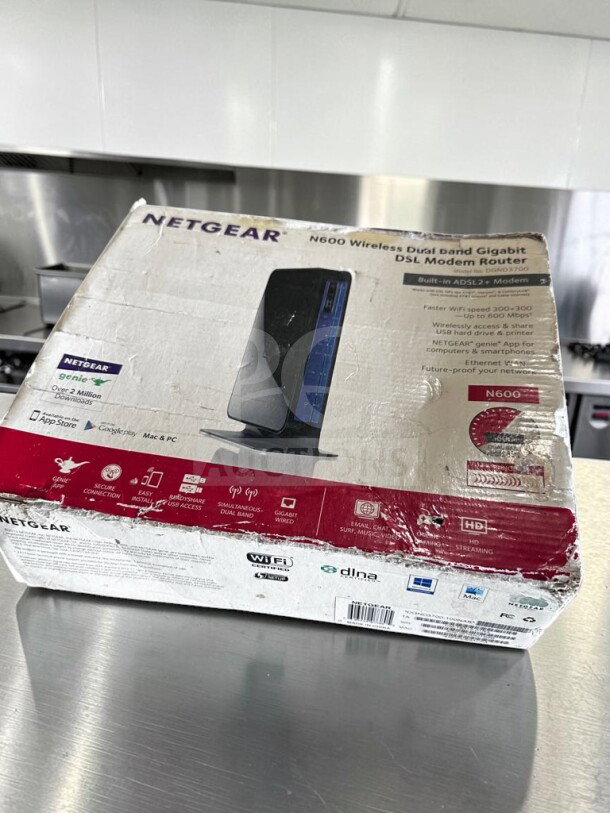 Brand new Netgear DGND3700-100NAS N600 wireless dual-band gigabit ADSL2+ modem router in original packaging.