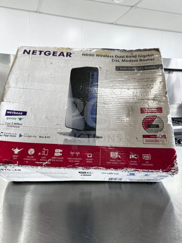 Netgear DGND3700-100NAS N600 Wireless Dual Band Gigabit ADSL2+ Modem Router, brand new in original packaging, shows features and apps.